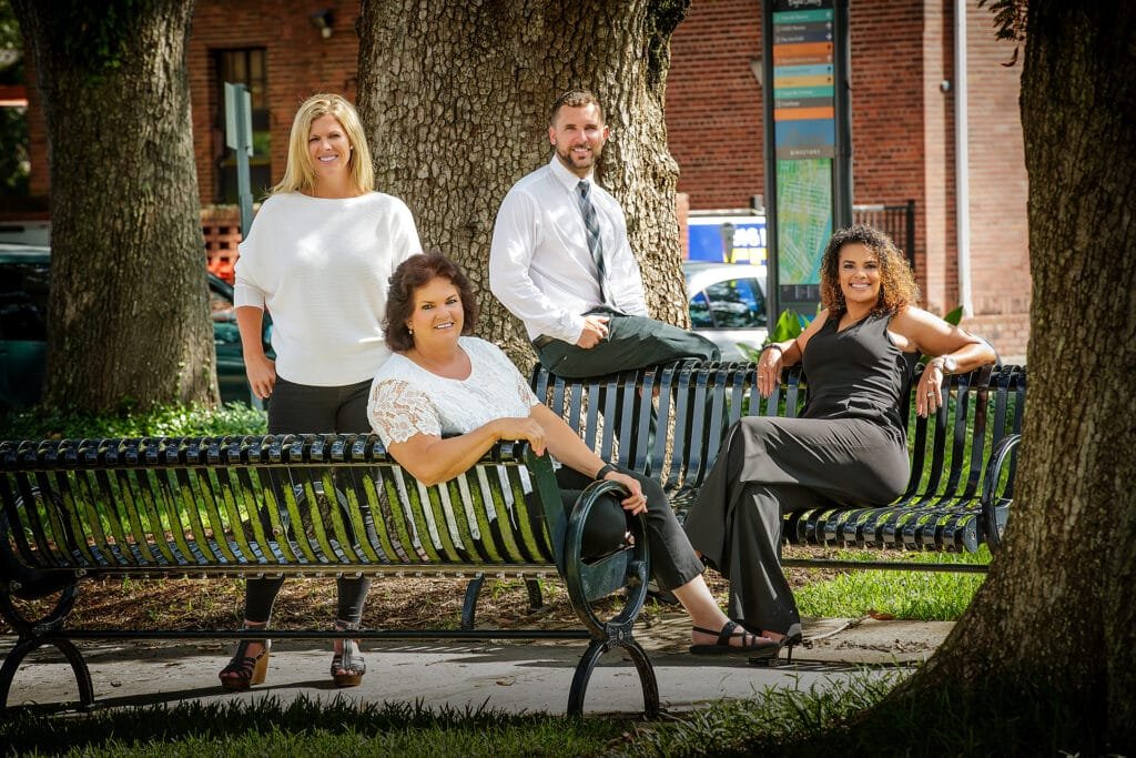 Real Estate Team Photo Outside by Kirk Voclain Houma